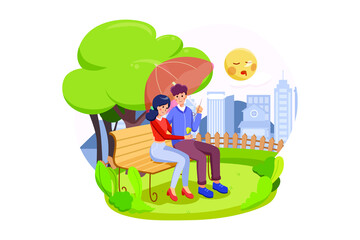 A happy couple sitting on a bench enjoy their valentine in autumn park 