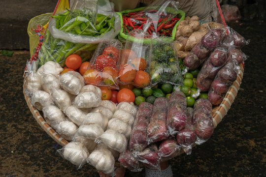 Vegetables packaged in plastic in a public market