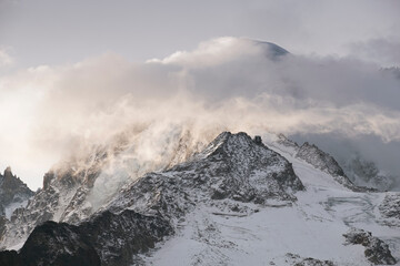 Fototapeta na wymiar Majestic view to the glacier in snowy peaks of the French Alps.