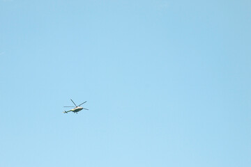 View of a helicopter in the sky. Helicopter ground view.