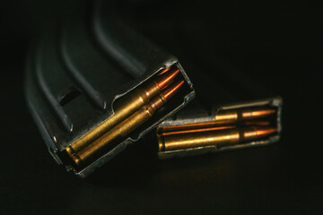 Top view of gun magazines on a black surface background. Rifle. M4. 5,56x45