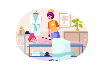 Woman doing massage to a woman with rocks.