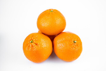 Ripe fresh juicy tangerines with leaves on white background