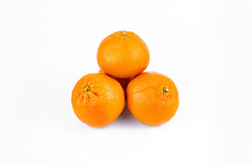 Ripe fresh juicy tangerines with leaves on white background