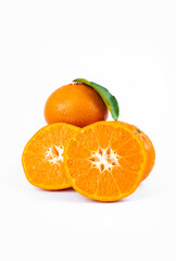 Ripe fresh juicy tangerines with leaves on white background