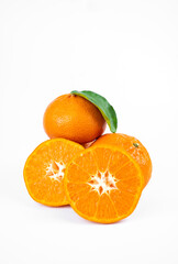 Ripe fresh juicy tangerines with leaves on white background