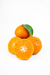Ripe fresh juicy tangerines with leaves on white background