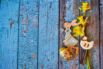 Wooden Easter bunny with flowers as decoration.