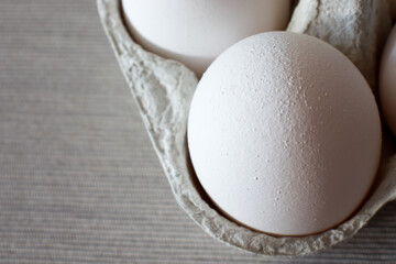 Closeup detail of eggs in a carton 