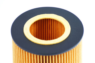High quality yellow filter element. The inside of the oil filter. Automotive oil filter close-up on a white background.