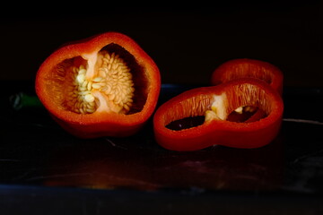 Pods of siliced fresh capia pepper - view from the inside.