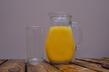 Fresh orange juice in a clear glass jug