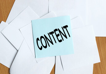 Content. text on blue sticker on table button holds sticker