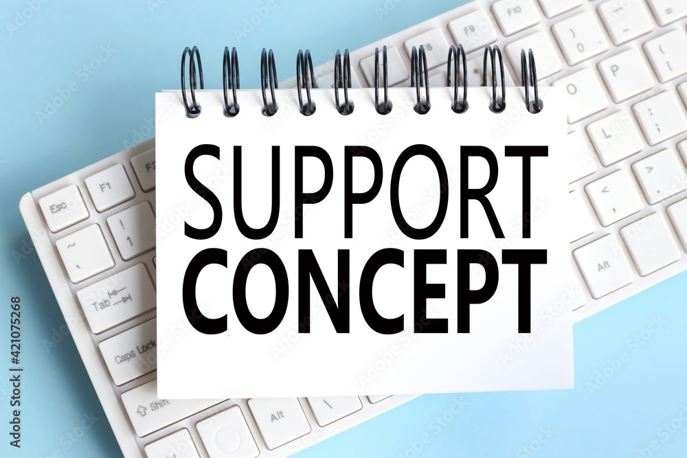 Poster support concept. text on white notepad paper on white keyboard