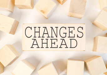 change ahead. text on a piece of wood. on a white background