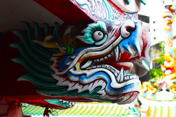 Fototapeta na wymiar A dragon head statue at a chinese shrine
