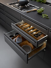 Modern kitchen, Open drawers, Set of cutlery trays in kitchen drawer. Solid oak wood cutlery drawer inserts. - obrazy, fototapety, plakaty