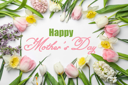Happy Mother's Day. Beautiful spring flowers on white background, flat lay
