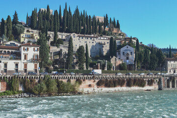View of the hill and the castle of St. Peter from the Adige river in Verona.