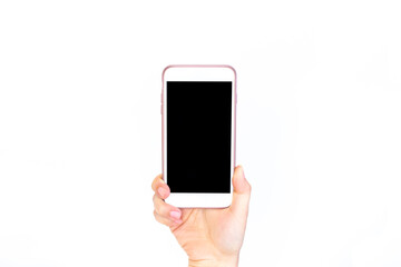Template for the design. White phone with black screen in female hand isolated on white background