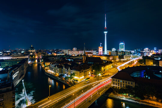 Berlin, Germany, panoramic view of Berlin cityscape and Spree River at night.