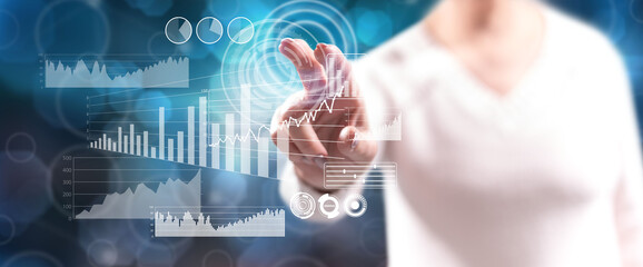 Woman touching a financial analysis concept
