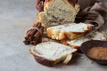 Babka or brioche bread with cinnamon and brown sugar. Homemade pastry for breakfast.