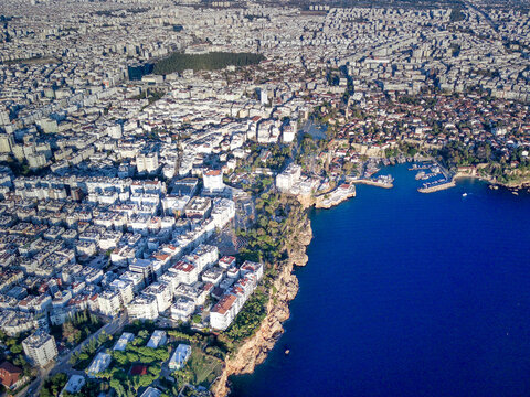 Aerial photograph of Antalya bay in Antalya city from high point of drone fly on sunny day in in Turkey. Amazing aerial cityscape view from birds fly altitude on beautiful town and sea full of yahts © Aleksey