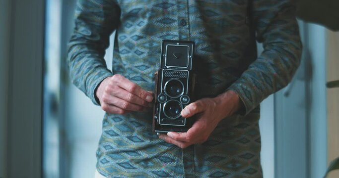 man with analog photo camera