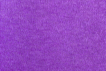 Knitted purple texture background. Knitwear