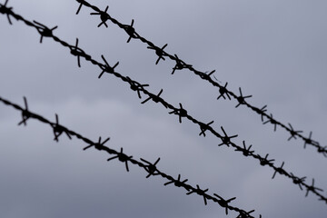 barbed wire against sky