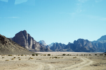 Fototapeta na wymiar Jordan, Wadi Rum Desert: Scenic landscape view of the desert with mountains