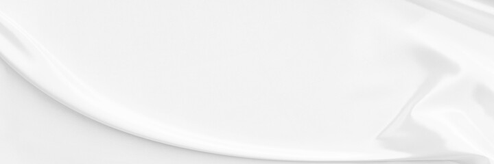 White gray satin texture that is white silver fabric silk panorama background with beautiful soft blur pattern natural.