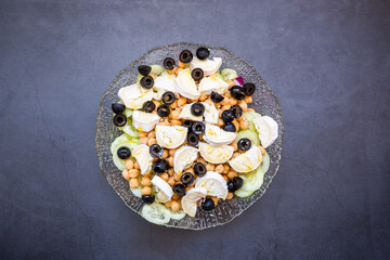 Mediterranean salad with goat cheese and black olives