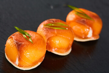 Mini canapes with smoked salmon and cream cheese. Finger food. Shallow dof.