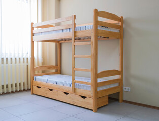 lacquered wooden bunk bed with mattresses