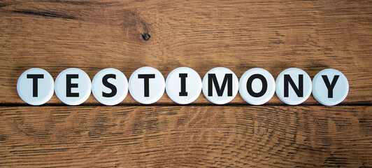 Testimony symbol. White circles with the word 'testimony'. Beautiful wooden background. Business, testimony concept. Copy space. - obrazy, fototapety, plakaty