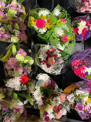An above (aerial) view of a grocery store display of fresh bouquets of flowers