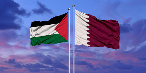 Qatar and Palestine two flags on flagpoles and blue cloudy sky