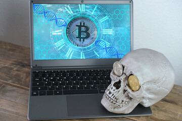human skull on a laptop keyboard, metal bitcoins in the eye sockets, the concept of cryptocurrency mining, the transience of life, the inevitability of death, the risk of monetary transactions
