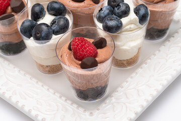 Mini chocolate brownie mousse and lemon cheesecakes