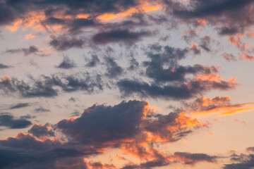 Skyscape cloudscape colorful dark orange blue sky clouds at evening sunset in Sunny Isles Beach, North Miami, Florida