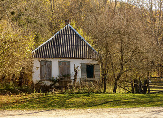 Old houses on a ranch on a sunny autumn day.