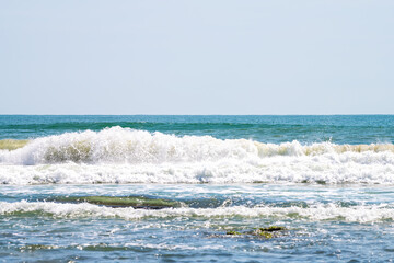 Atlantic ocean water waves splashing crashing at Marineland River to Sea preserve park in Florida on sunny summer day