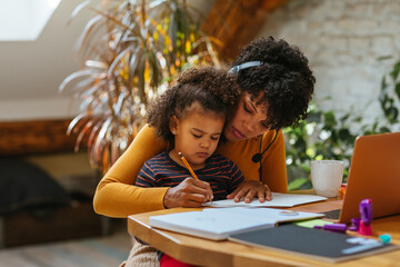 Mother and daughter drawing together