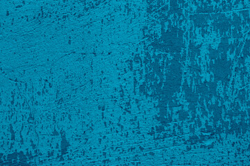 The texture of the old blue wall. Blue background, scratched wall in Athens.
