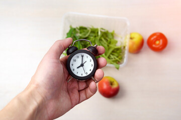Time For Health copy space. alarm clock in hand selective focus