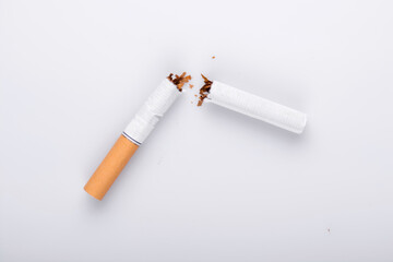 Broken cigarette on white background , World No Tobacco Day Tobacco and lung health concept .