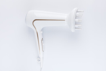 Hairdryer with a diffuse styling attachment on a white background