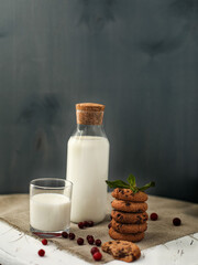 Fresh milk in a glass bottle and chocolate chip cookies